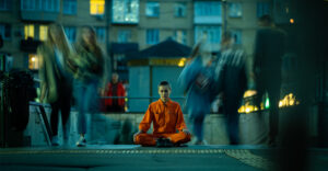 a girl meditating on the crowded street